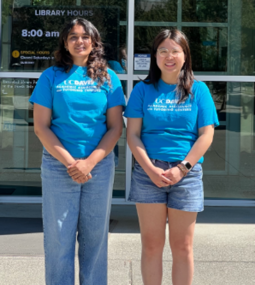 Our 2 Lead Tutors standing in front of Library