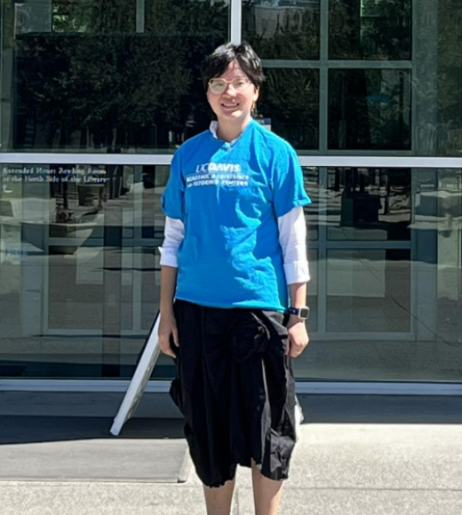Woman in Front of Library in Blue Shirt