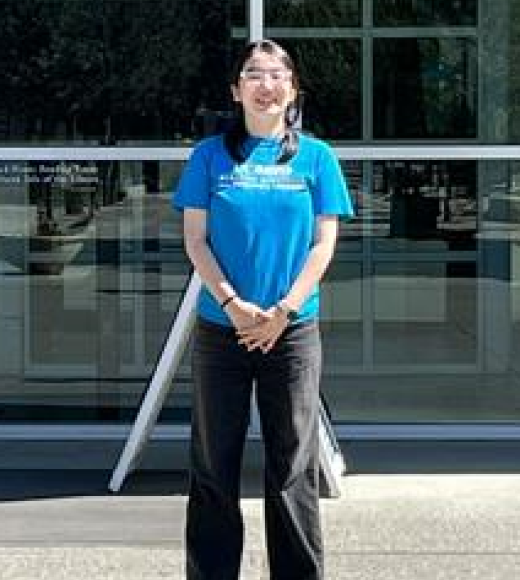 Woman in Front of Library in Blue Shirt
