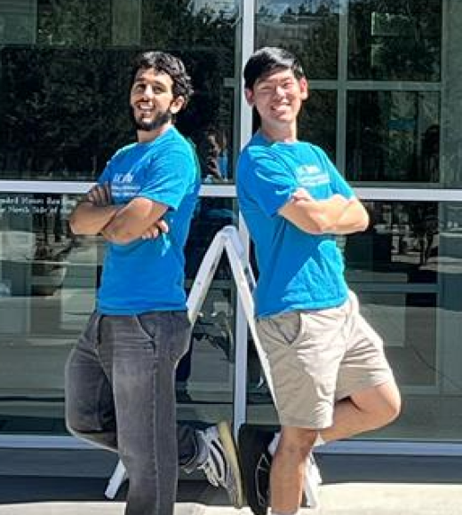 2 Men Head Subject Tutors standing back to back 